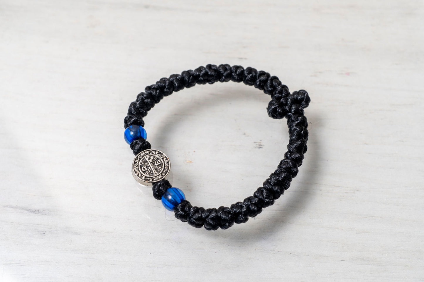 Elastic Prayer Rope Komboskini Bracelet with Chi-Rho Medallion and Blue Beads - 33 Knots - 1 Piece - Black Cord