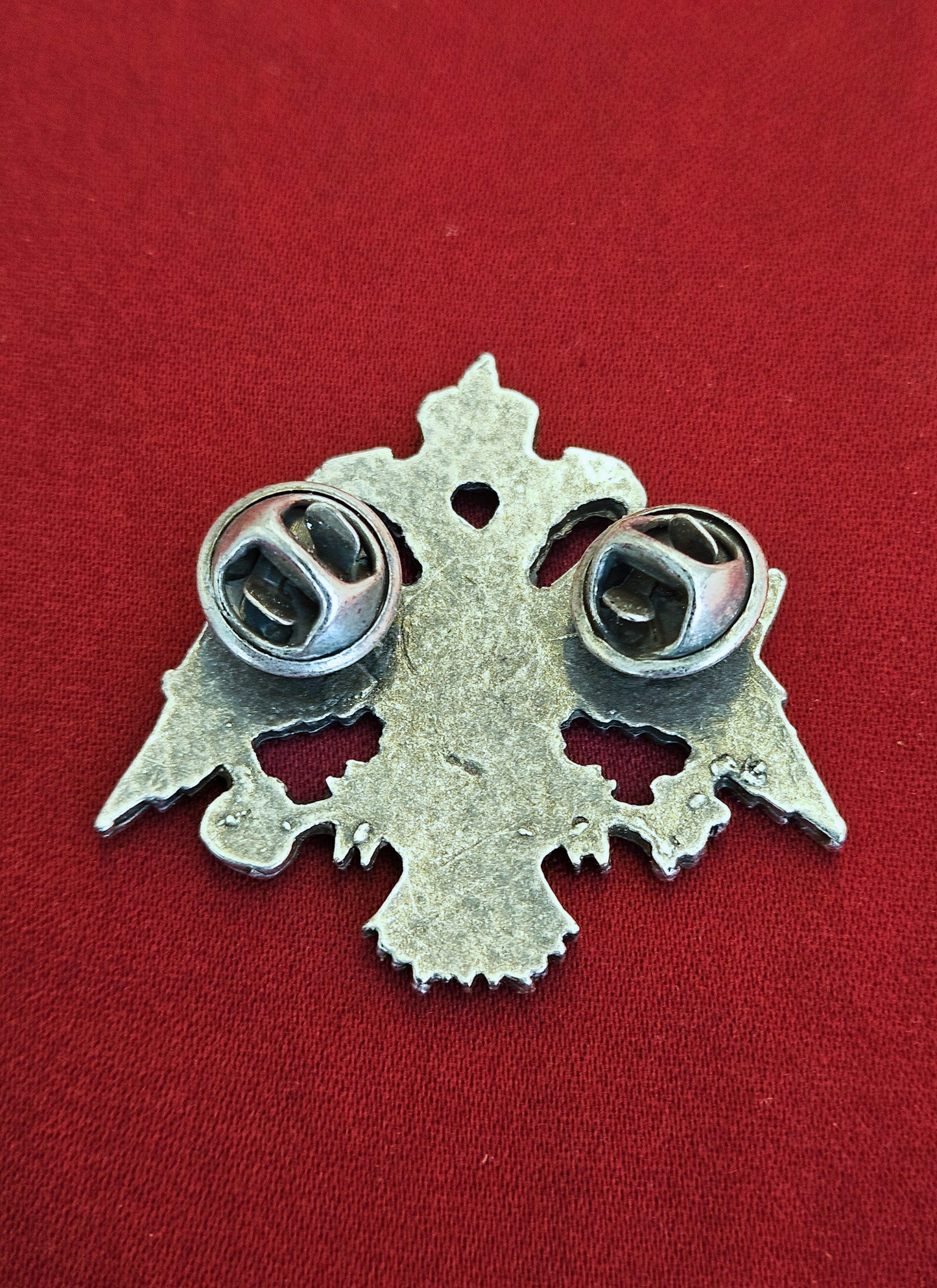 Back view of the large antique silver Byzantine eagle brooch showing the secure double butterfly clutch pins