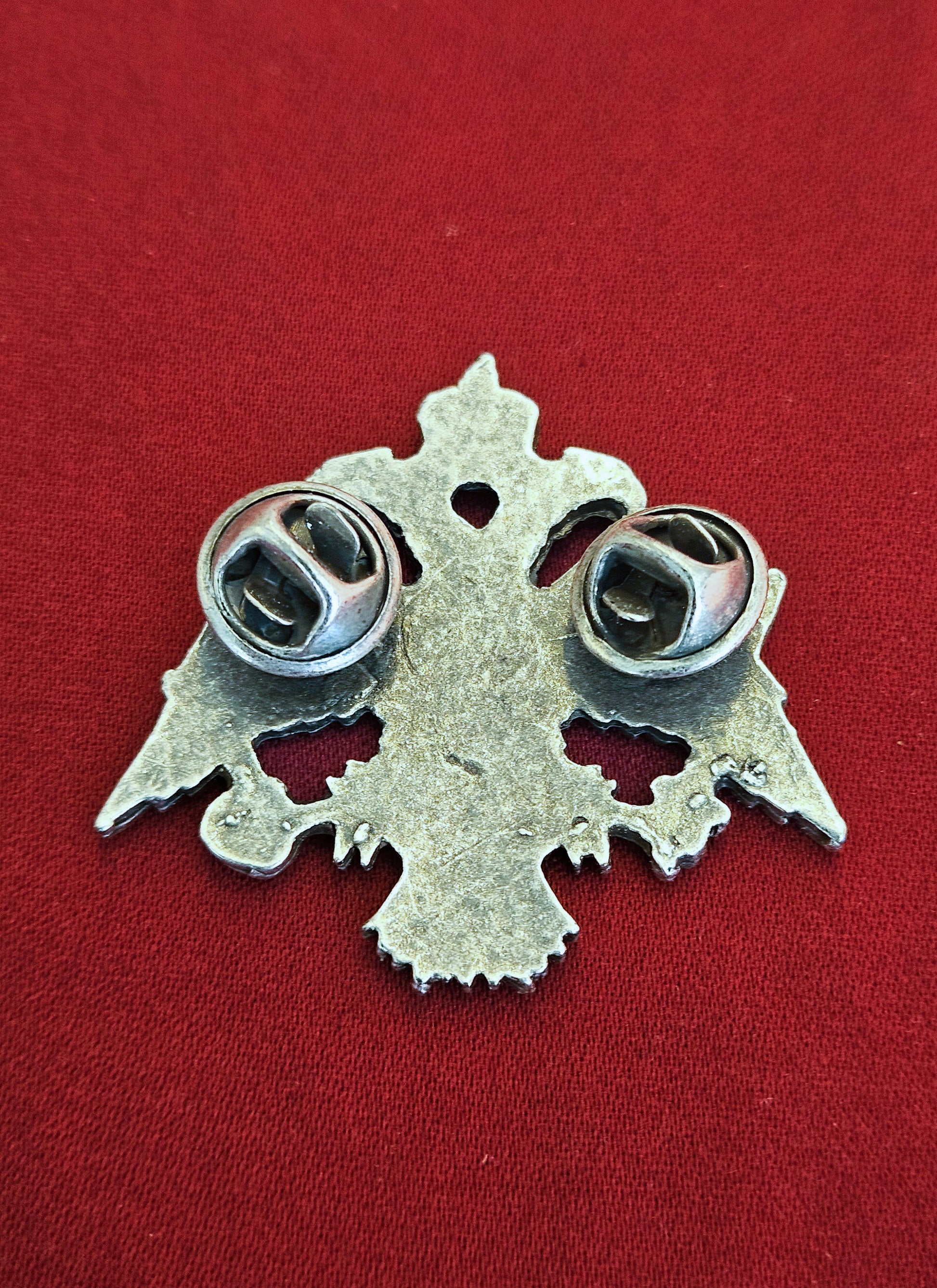 Back view of the large antique silver Byzantine eagle brooch showing the secure double butterfly clutch pins