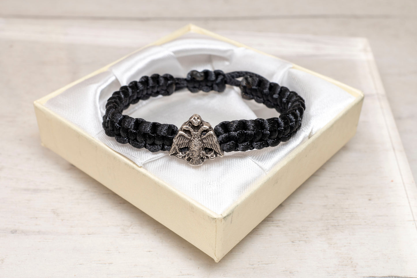 Handcrafted black macrame Byzantine double headed eagle bracelet inside a premium white gift box with satin lining
