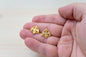 Handcrafted Orthodox double headed eagle crest pins on a hand for size reference