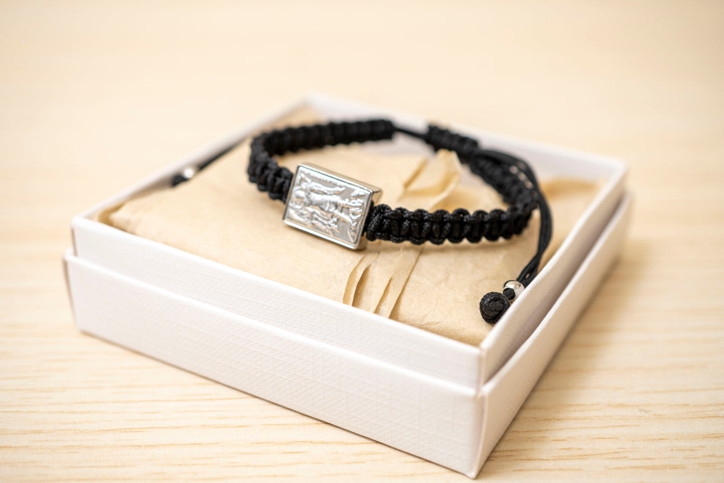 Orthodox macrame prayer bracelet with a silver Archangel Michael icon.