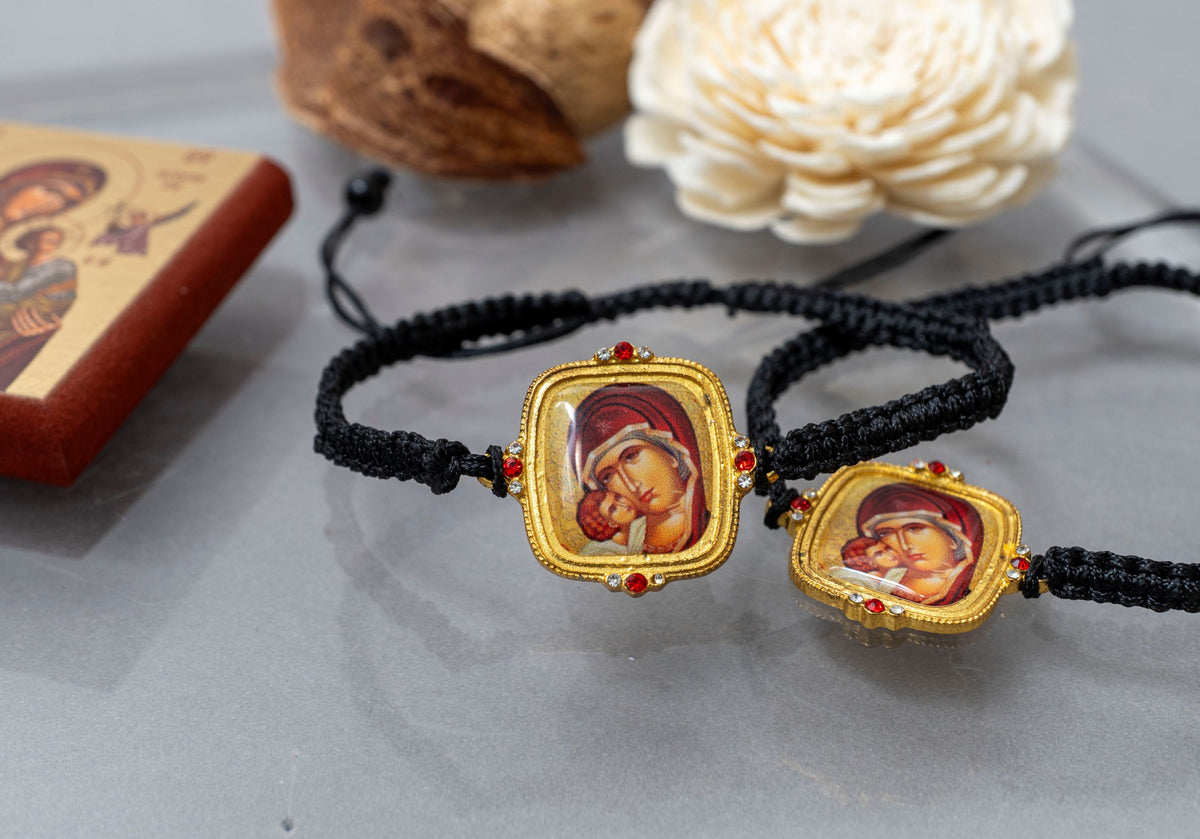 Adjustable knotted black cord bracelet with Virgin Mary icon and crystal accents gold tone made in Greece