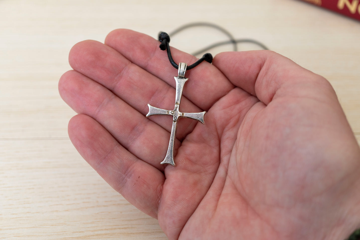 Handcrafted minimalist Orthodox metal cross pendant with flared ends on adjustable black genuine leather cord in craft gift box