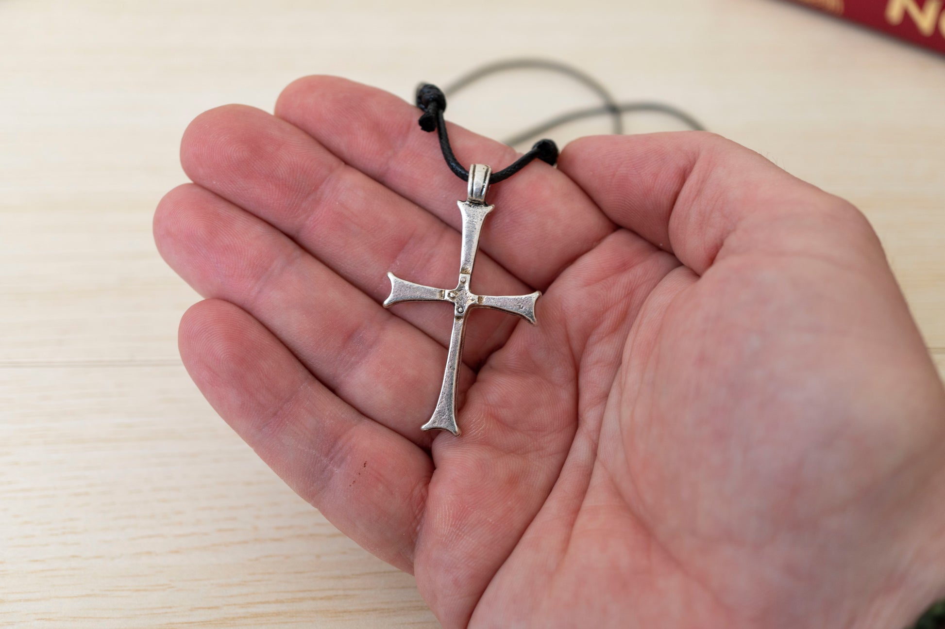 Handcrafted minimalist Orthodox metal cross pendant with flared ends on adjustable black genuine leather cord in craft gift box