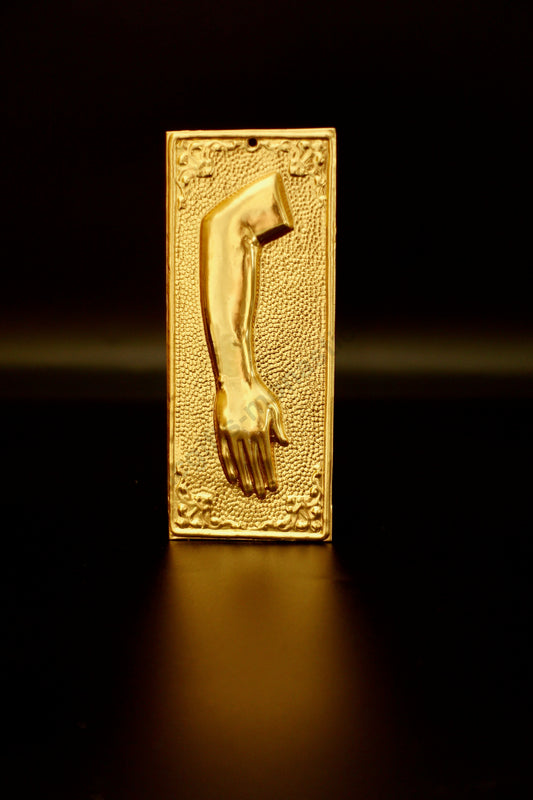 Plain gold-tone Greek Orthodox tama votive offering plaque embossed with a right human arm and hand design and a small pre-drilled top hole for hanging.