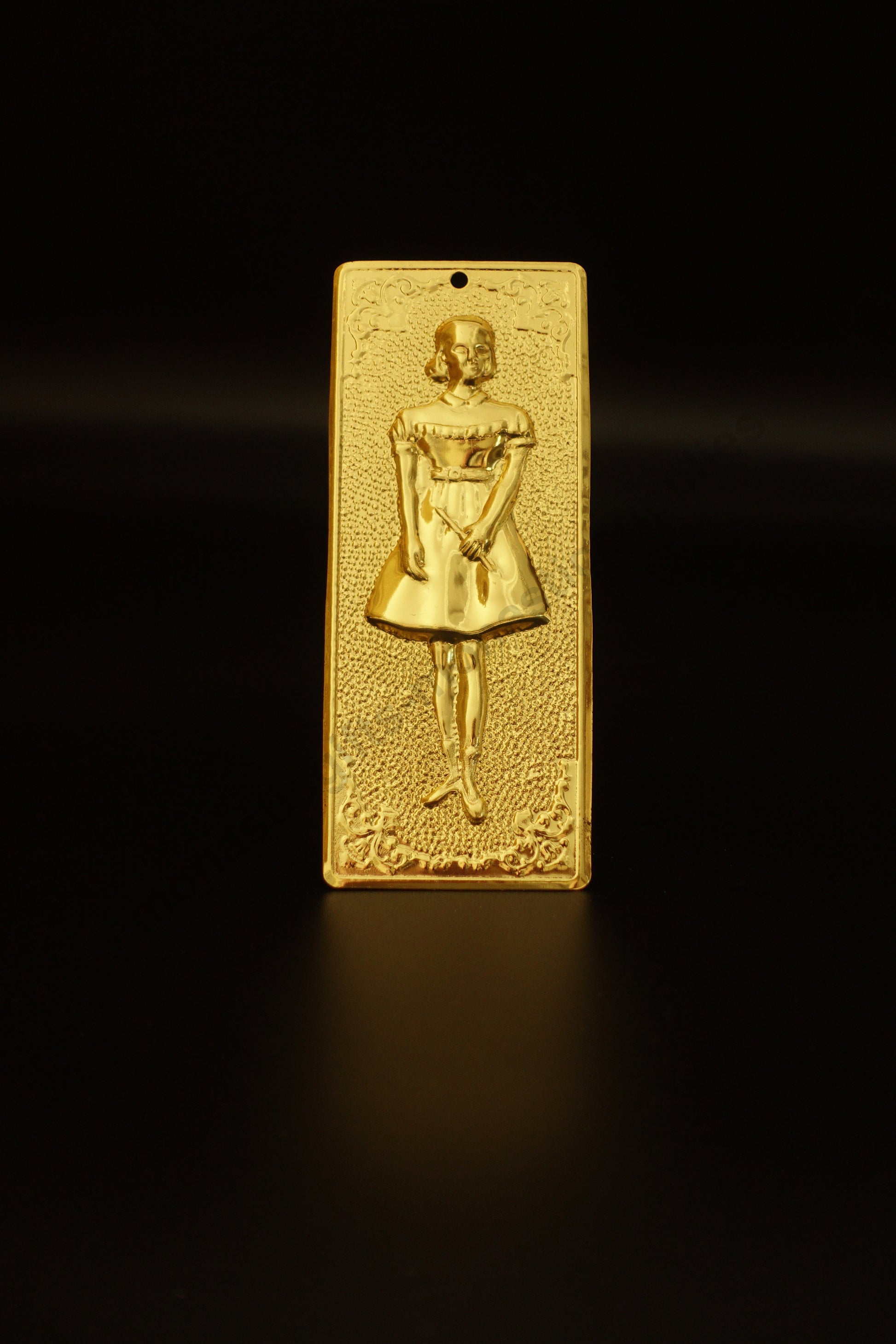 Plain gold-tone Greek Orthodox tama votive offering plaque embossed with a young girl child figure and a small pre-drilled top hole for hanging.