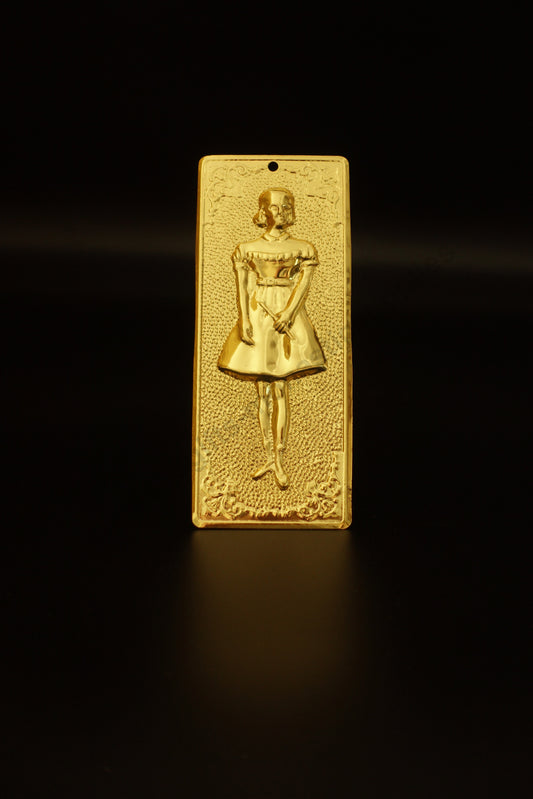 Plain gold-tone Greek Orthodox tama votive offering plaque embossed with a young girl child figure and a small pre-drilled top hole for hanging.