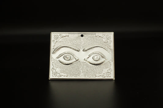 Plain silver-tone Greek Orthodox tama votive offering plaque embossed with a pair of eyes motif and a small pre-drilled top hole for hanging.