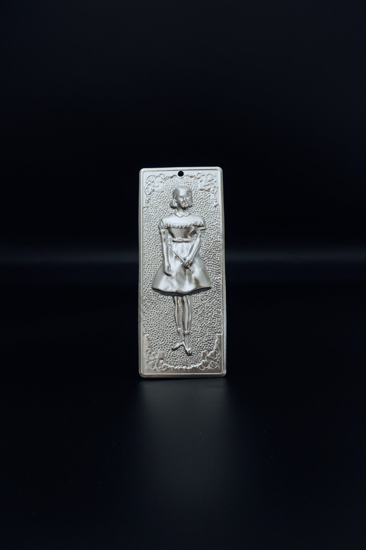 Plain silver-tone Greek Orthodox tama votive offering plaque embossed with a young girl figure and a small pre-drilled top hole for hanging.
