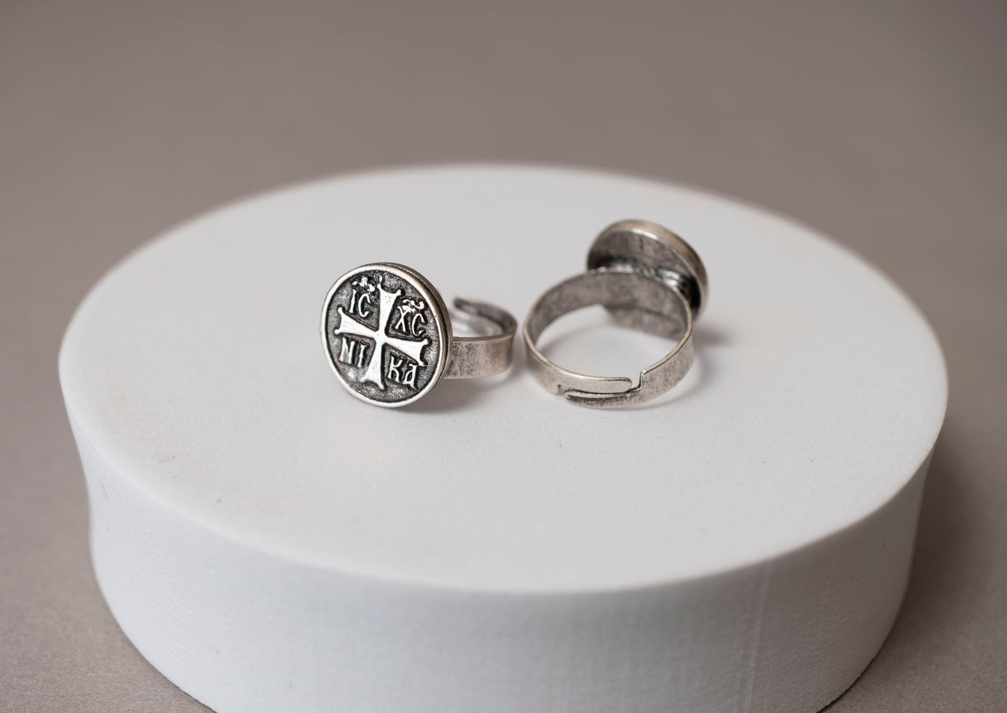 Antique silver IC XC NI KA Orthodox cross signet ring shown next to a holy icon and wooden cross (1 piece)
