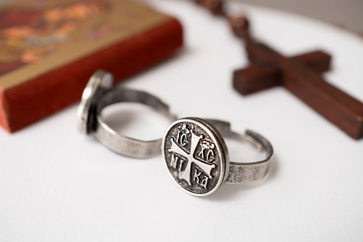 Antique silver IC XC NI KA Orthodox cross signet ring shown next to a holy icon and wooden cross (1 piece)
