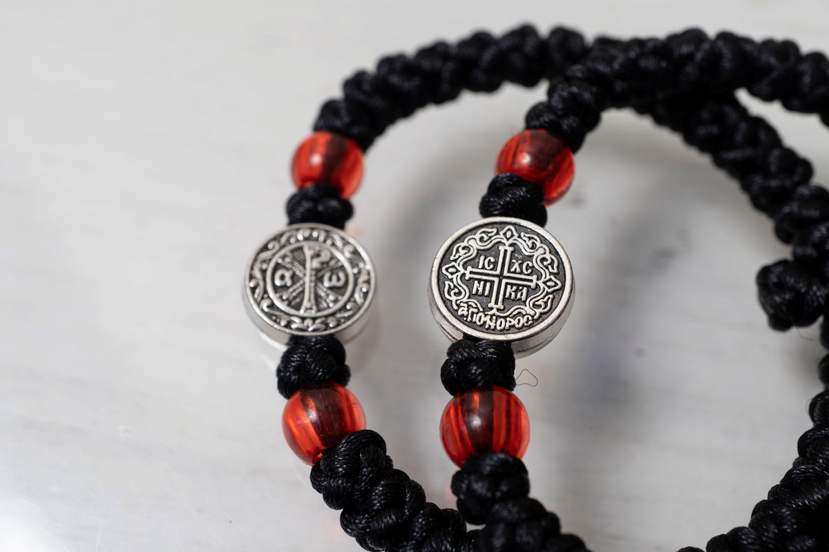 Elastic Prayer Rope Komboskini Bracelet with Chi-Rho Medallion and Red Beads - 33 Knots - Black Cord