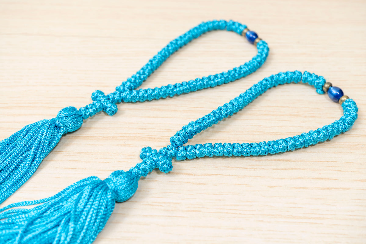 Light blue 50 knots prayer rope komboskini with cross tassel and accent bead made in Greece