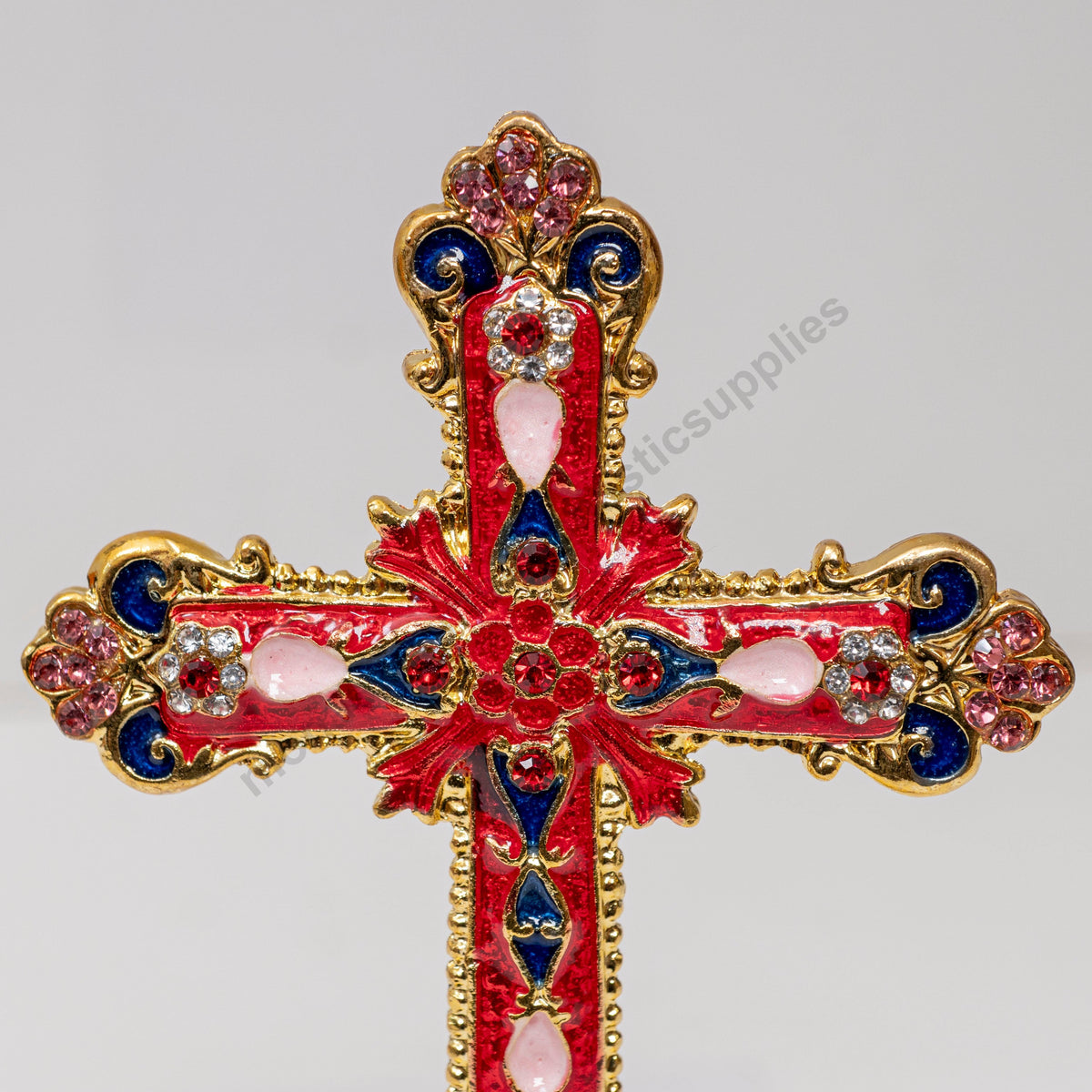 Tabletop standing cross trinket box with red enamel gold filigree and crystals on decorative base