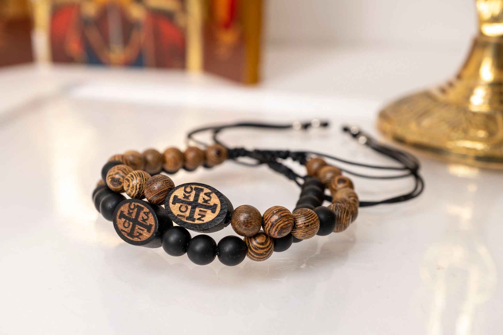 tacked pair of handcrafted natural wood and matte black Orthodox IC XC NIKA prayer bracelets