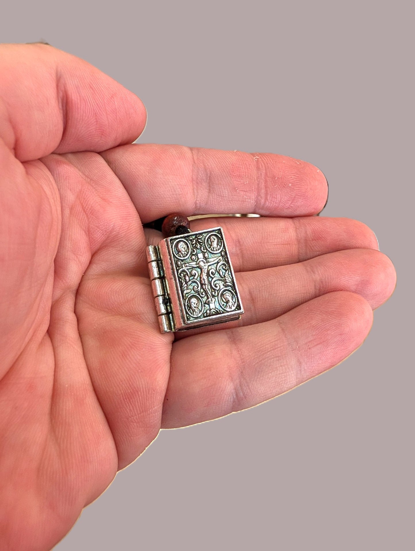 Miniature metal Gospel book locket pendant with Crucifixion and Lords prayer silver tone 2.5x2 cm (0.98x0.78 in) made in Greece