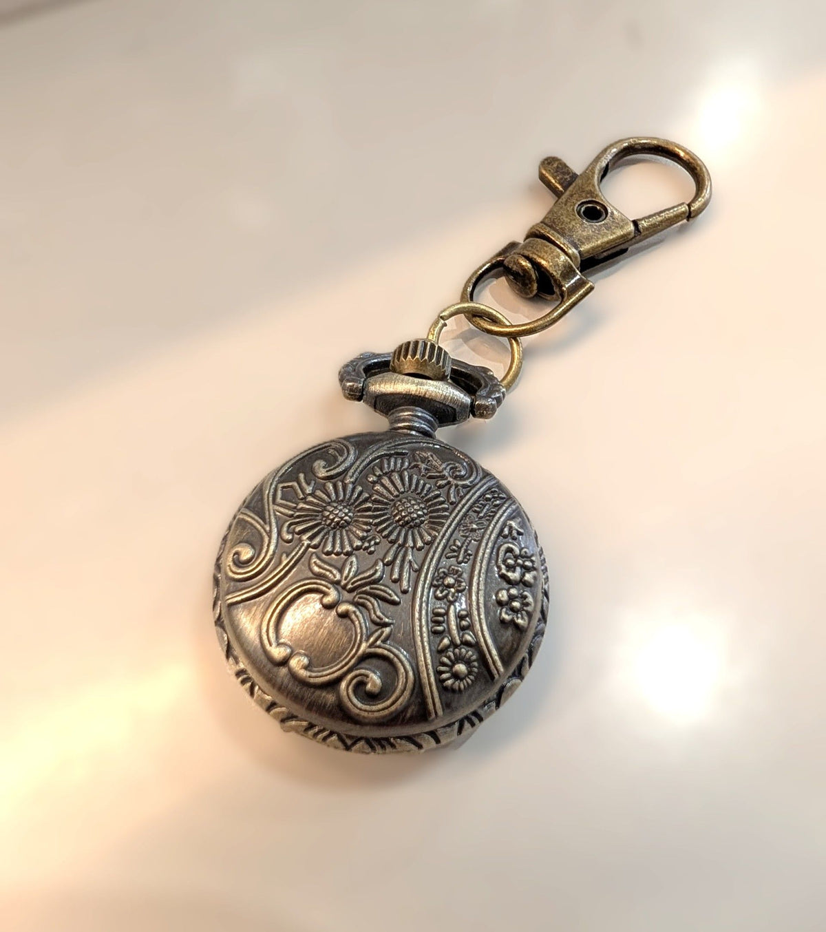 Mini pocket watch keychain antique bronze with cutout cross front and swivel bag clip
