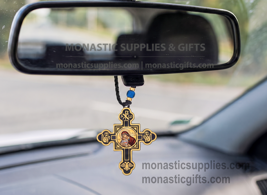 Byzantine double-sided hanging cross protection amulet with gold and black accents, featuring an Orthodox icon of Virgin Mary on one side and Jesus Christ on the reverse, Chi-Rho symbol at the top, praying angels, and a double-headed eagle on a wooden surface.