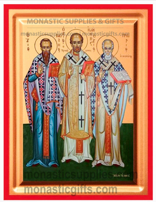 Byzantine Orthodox icon of the Three Holy Hierarchs on gold leaf canvas with a red border.
