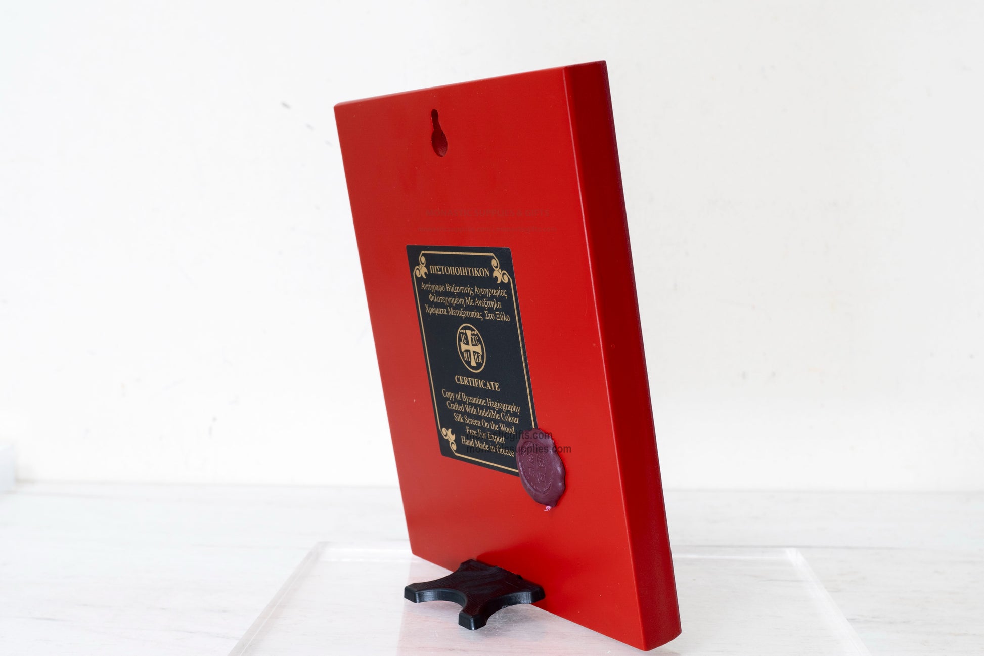 Red painted back view of the Orthodox wooden icon showing the Certificate of Authenticity and traditional wax seal