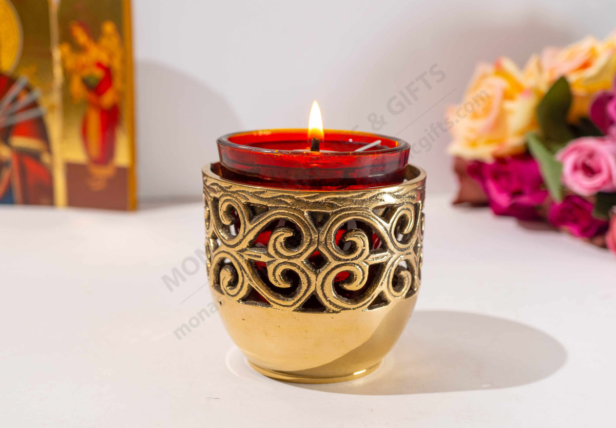 Solid brass vigil lamp standing oil burner with ornate cut out pattern and heat resistant red glass cup