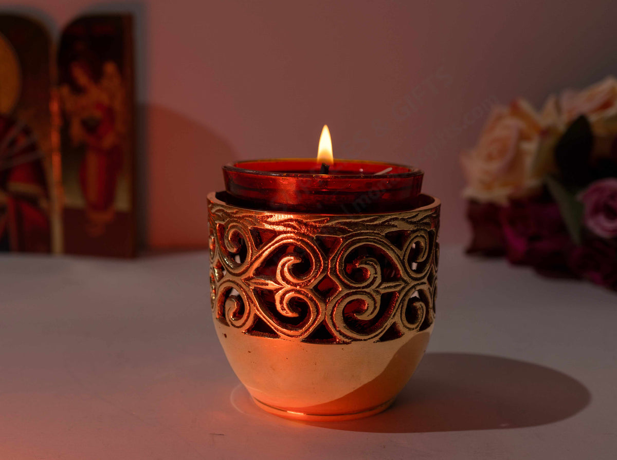 Solid brass vigil lamp standing oil burner with ornate cut out pattern and heat resistant red glass cup