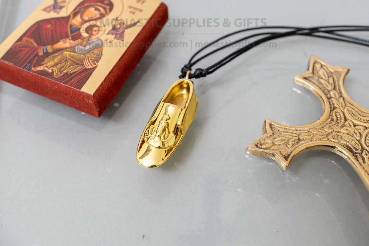 Archangel Michael Panormitis slipper pendant necklace gold tone metal on adjustable black cord with kraft gift box handmade in Greece[cite: 13, 14]