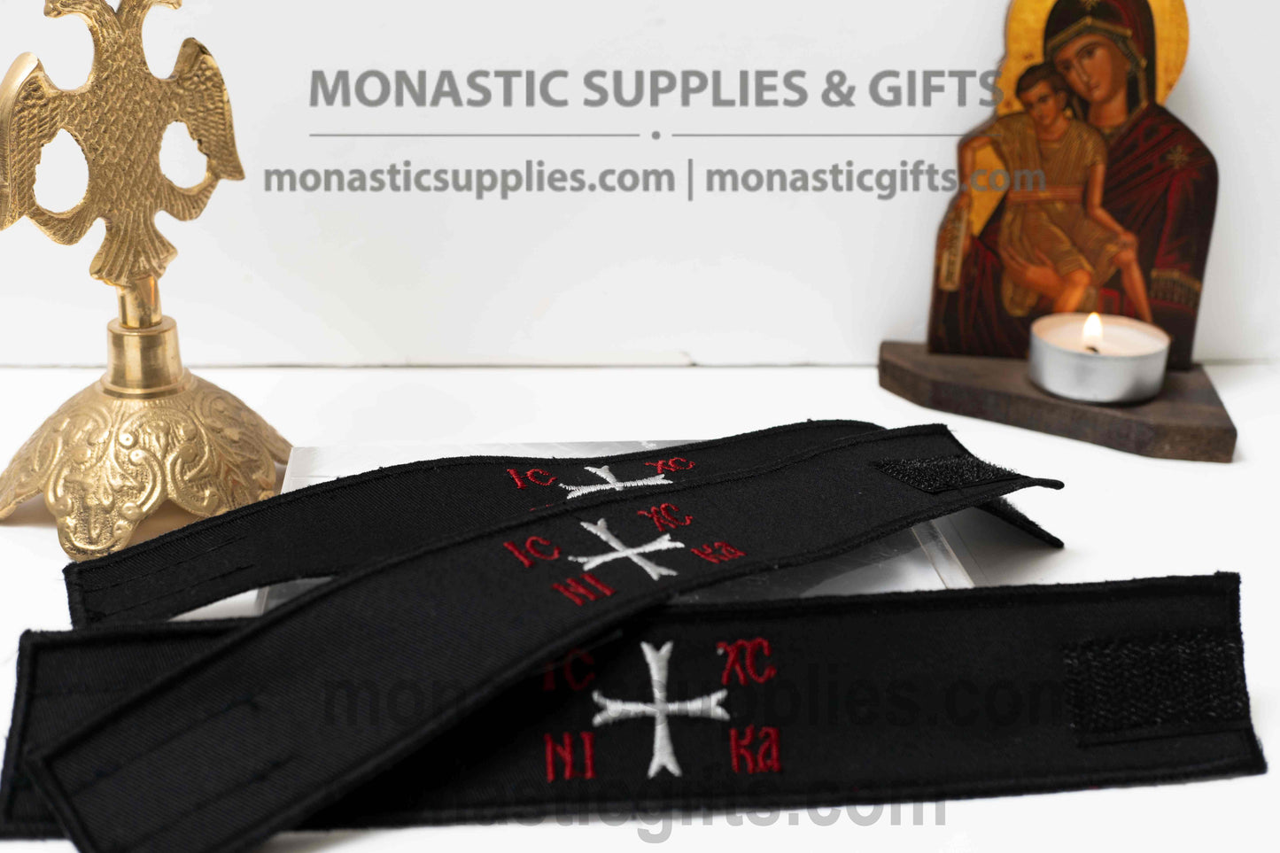 Handcrafted black fabric Orthodox wristband with embroidered white Byzantine cross and red IC XC NIKA inscription made in Greece
