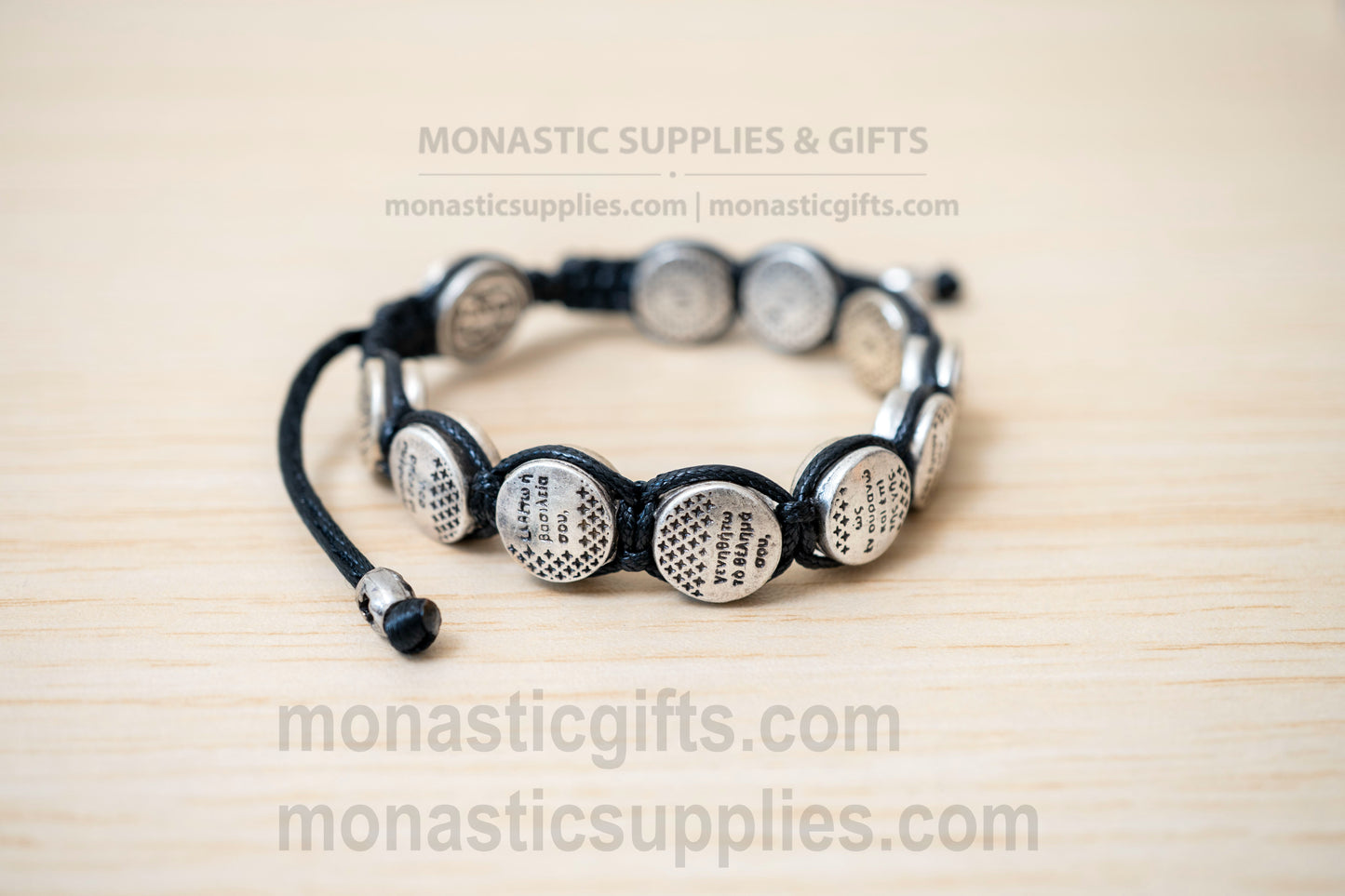 Orthodox macrame bracelet with silver beads engraved with the Lord's Prayer.