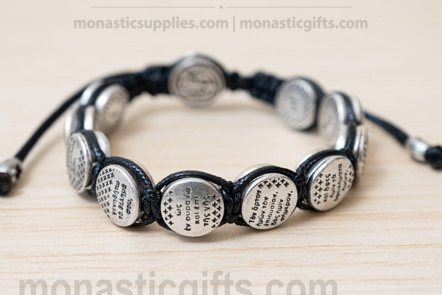 Orthodox macrame bracelet with silver beads engraved with the Lord's Prayer.