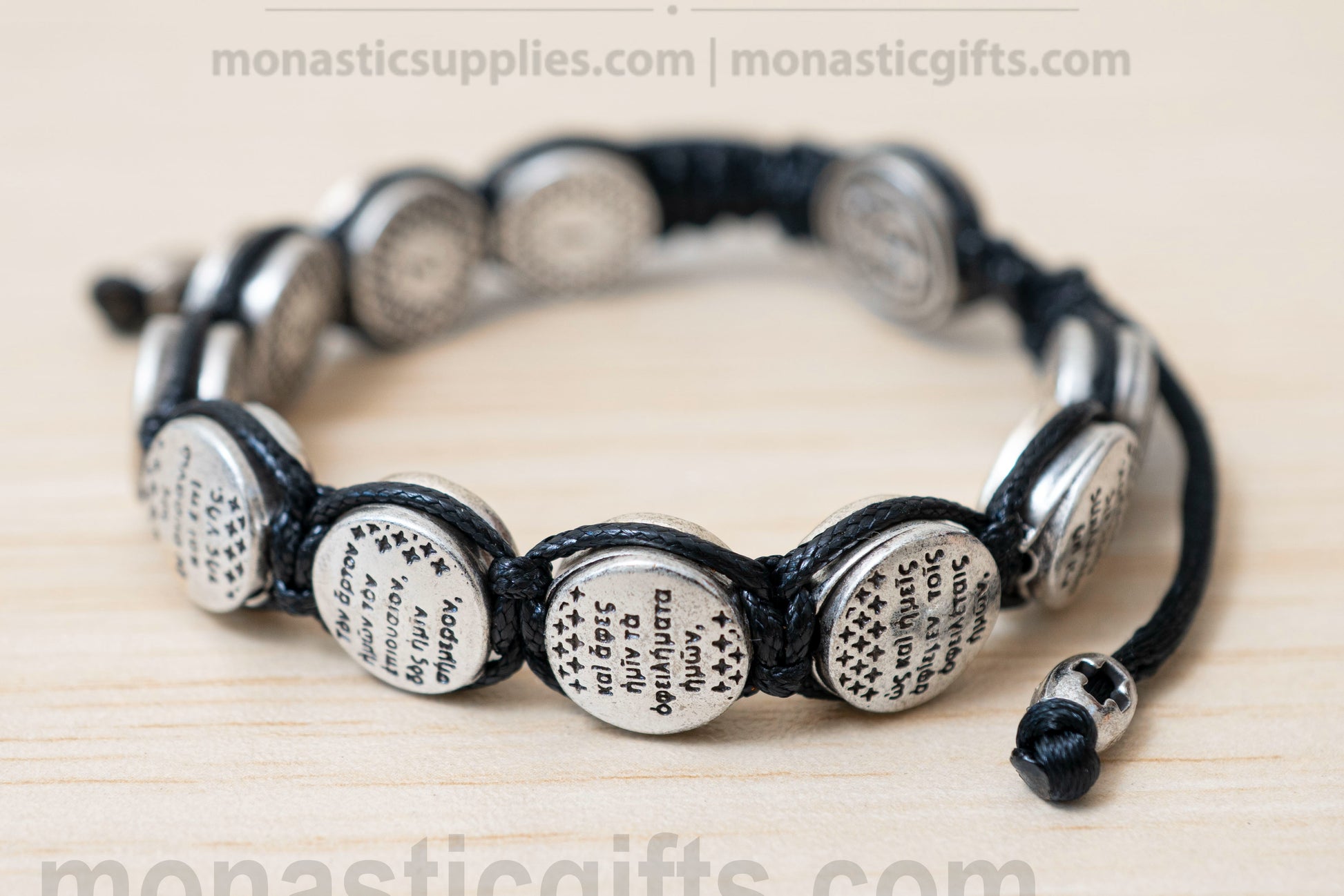 Orthodox macrame bracelet with silver beads engraved with the Lord's Prayer.