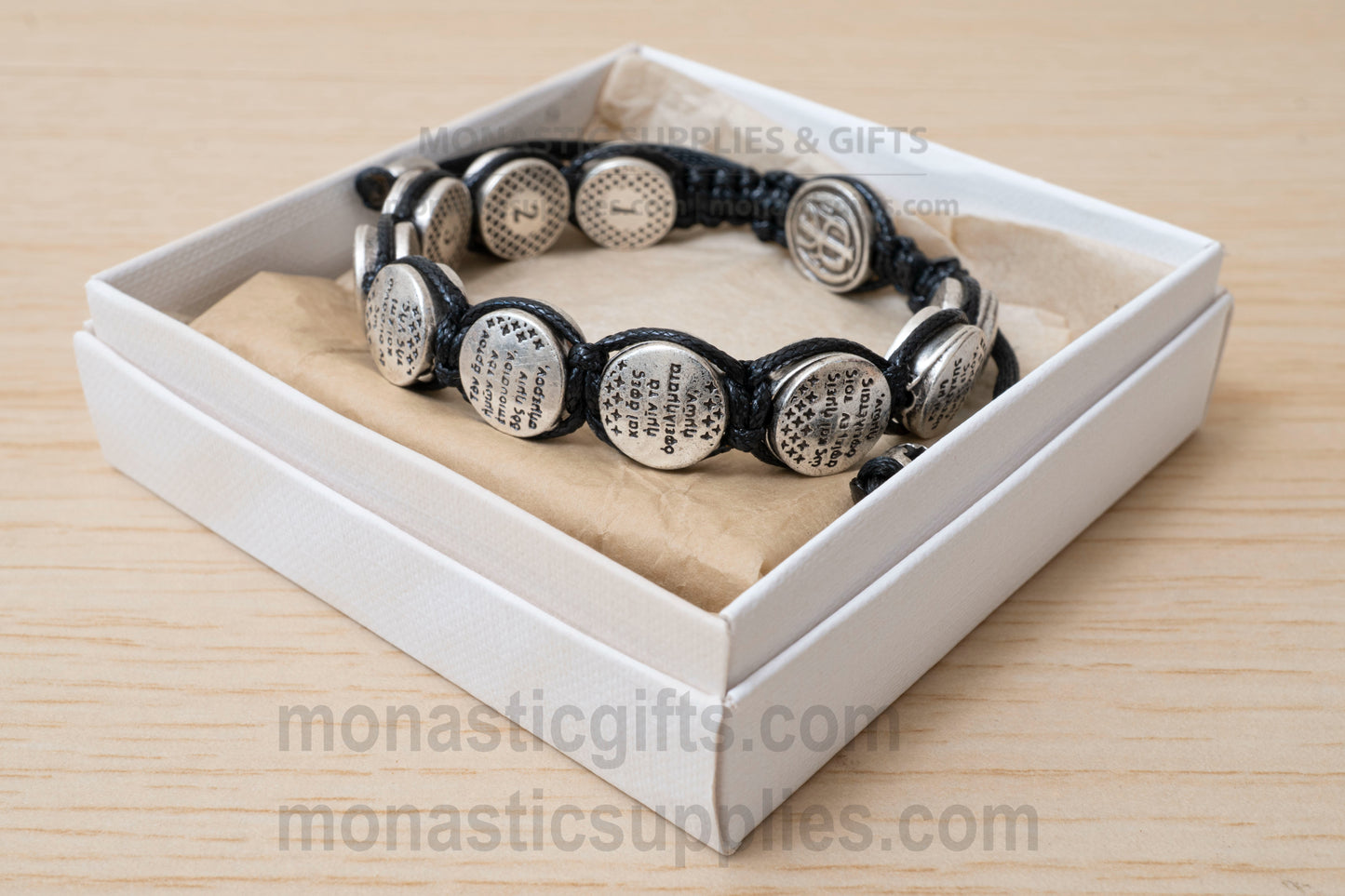 Orthodox macrame bracelet with silver beads engraved with the Lord's Prayer.