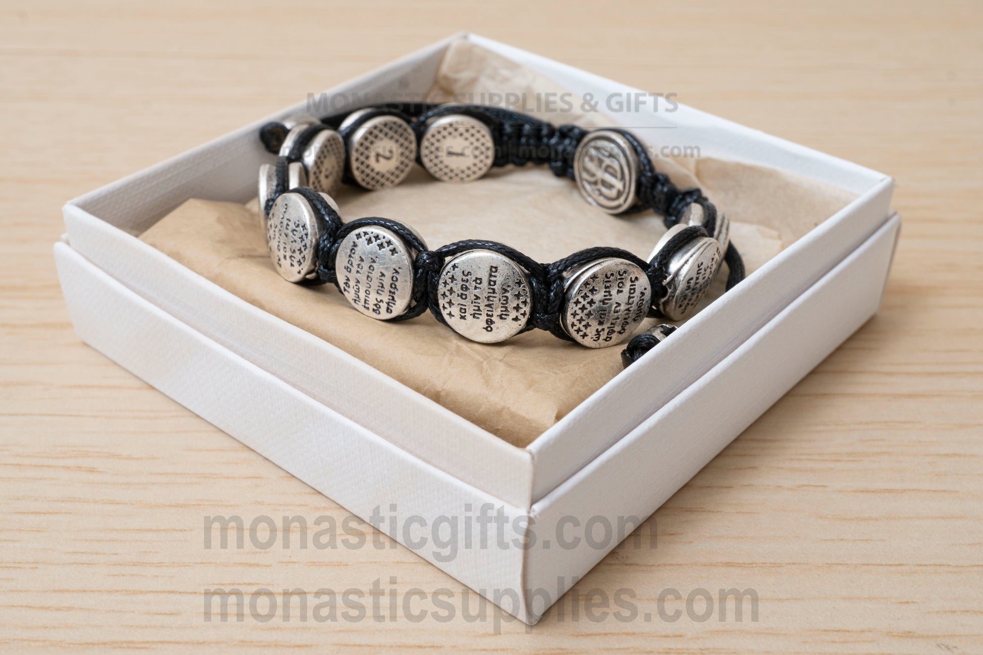 Orthodox macrame bracelet with silver beads engraved with the Lord's Prayer.