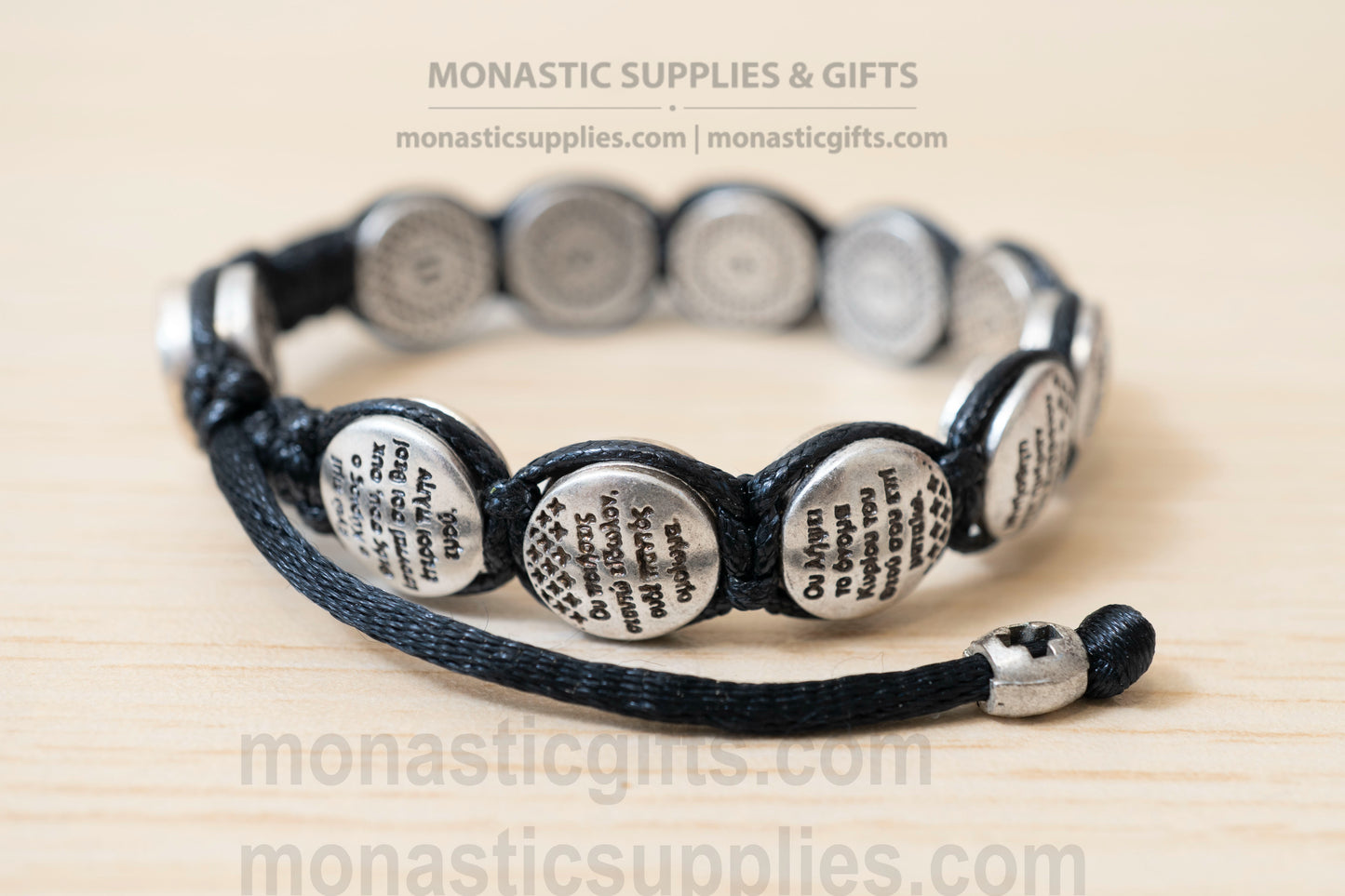 Orthodox macrame bracelet with silver beads engraved with the Ten Commandments.