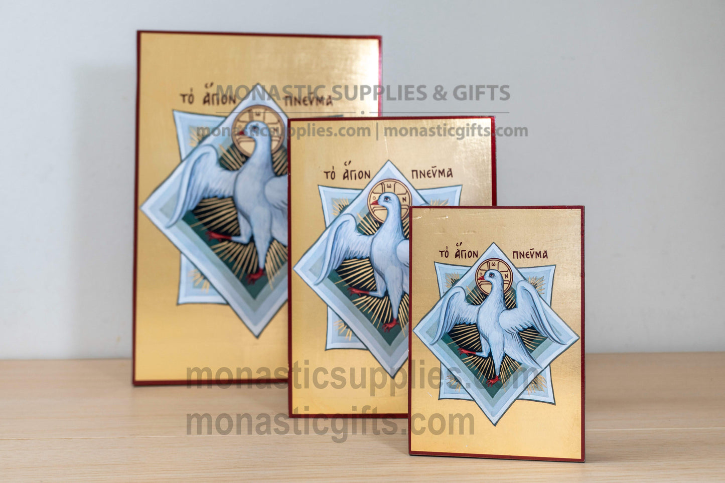 Handcrafted Byzantine silkscreen icon of the Holy Spirit depicting a white dove on shimmering gold leaf wood plaque, available in multiple sizes.