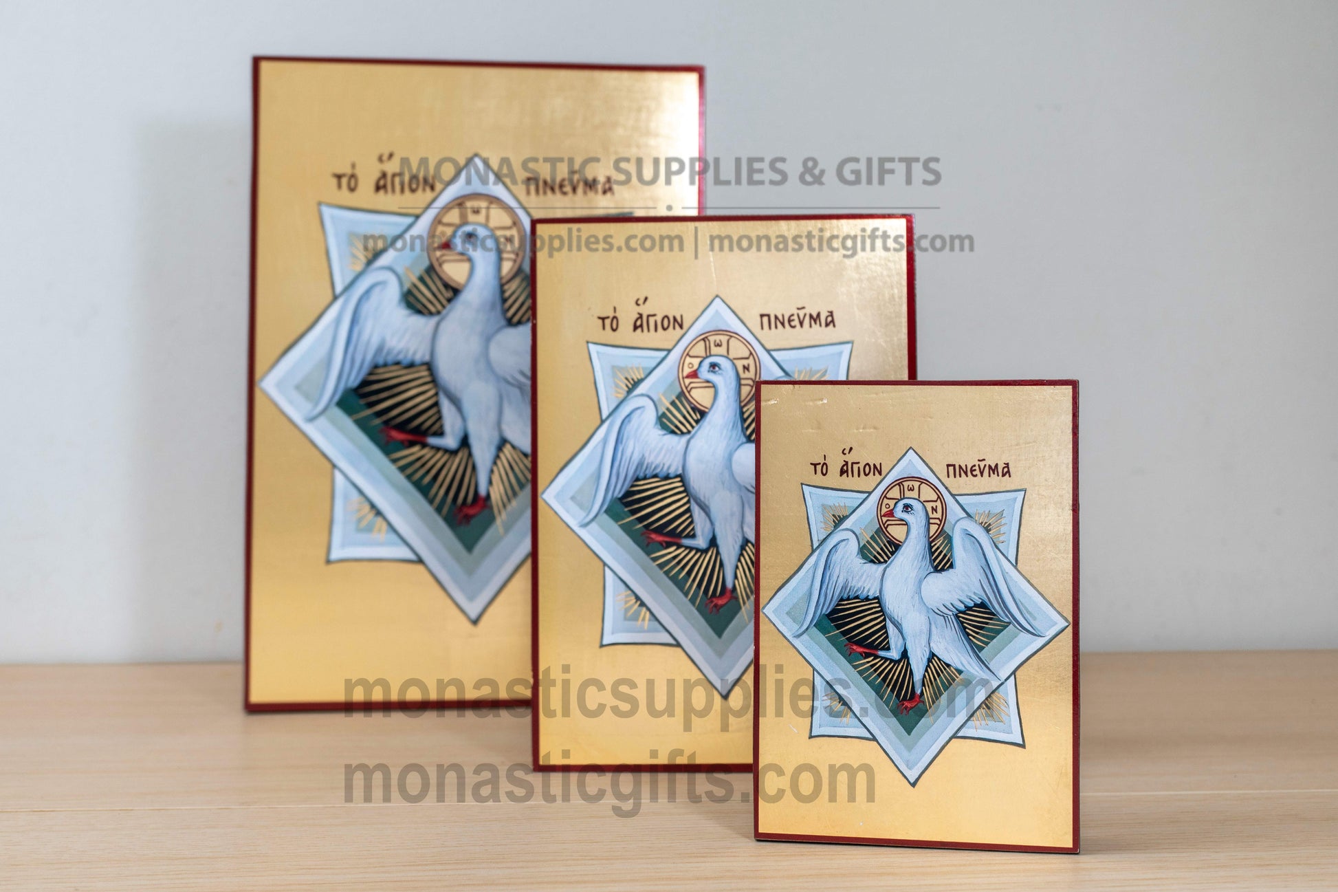 Handcrafted Byzantine silkscreen icon of the Holy Spirit depicting a white dove on shimmering gold leaf wood plaque, available in multiple sizes.