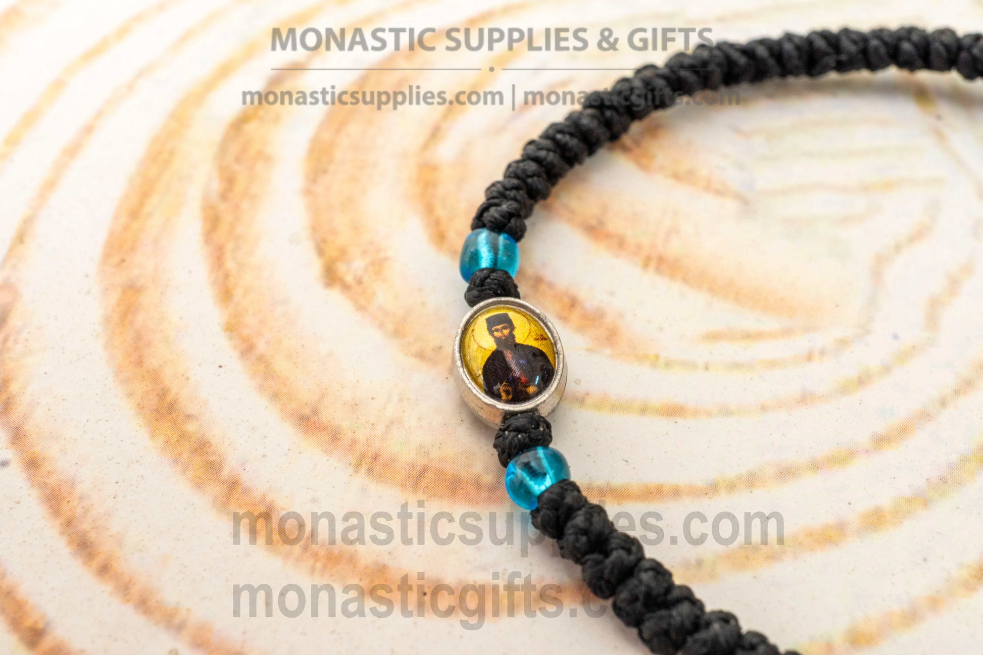 Handcrafted Orthodox black waxed cord 33 knot prayer rope bracelet with tiny Saint Ephraim icon medallion and knotted cross