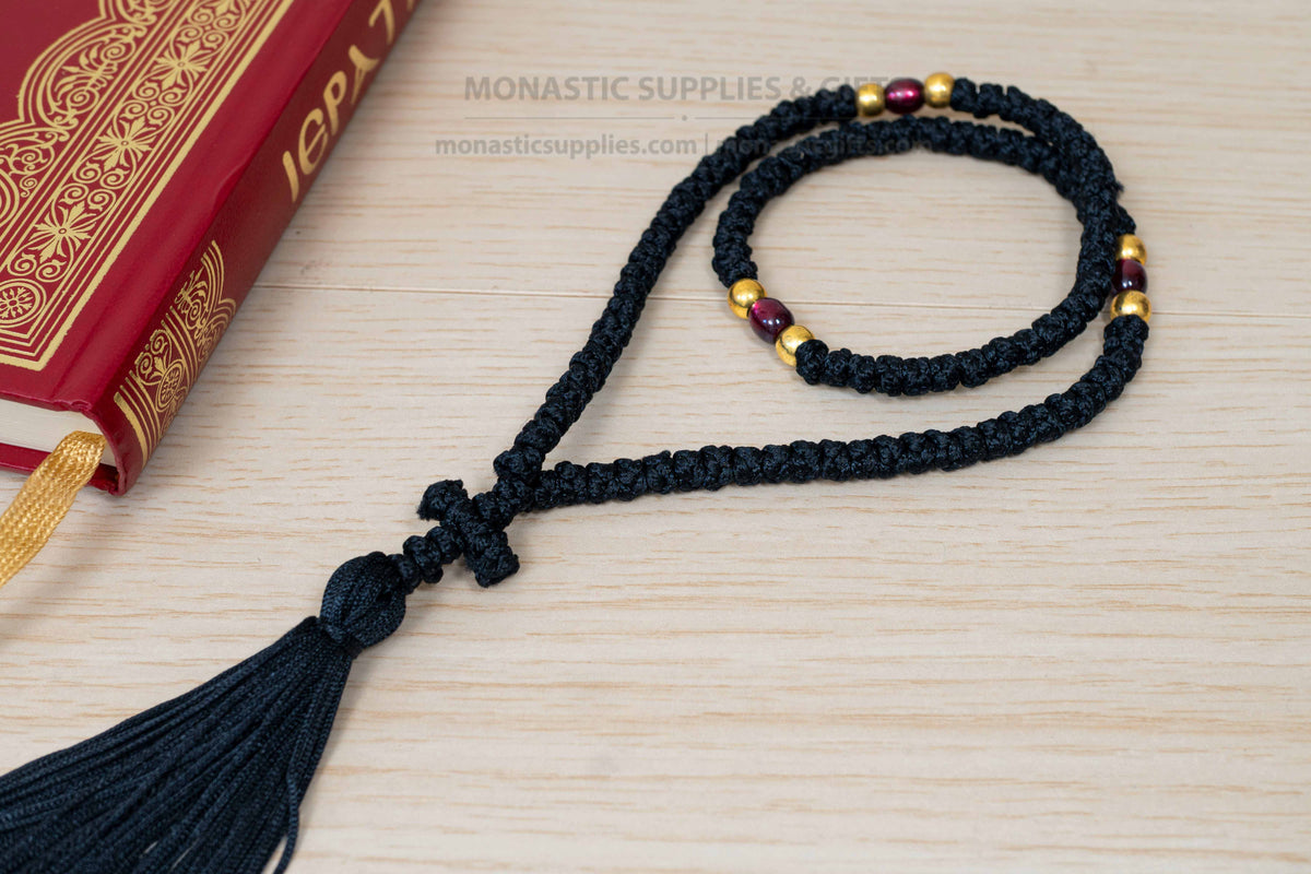 Monastic Orthodox prayer rope 100 knots with tassel knotted cross gold and translucent red beads in black cord made in Greece