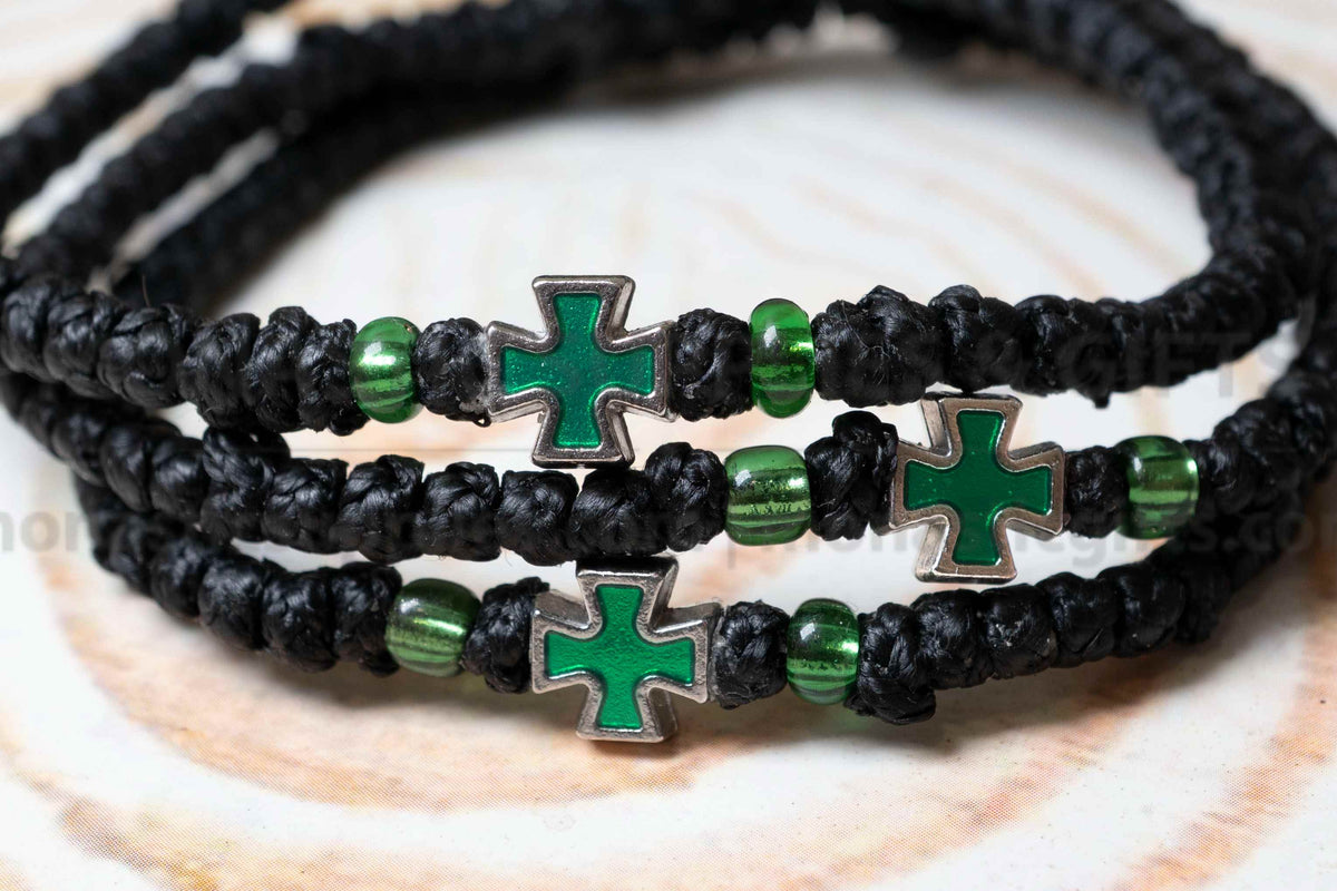Prayer rope komboskini bracelet with green enamel cross and black knots made in Greece[cite: 6]