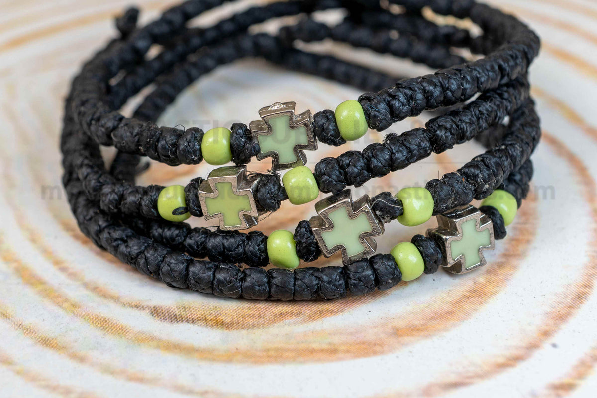 Prayer rope komboskini bracelet with light green enamel cross and black knots made in Greece[cite: 7]