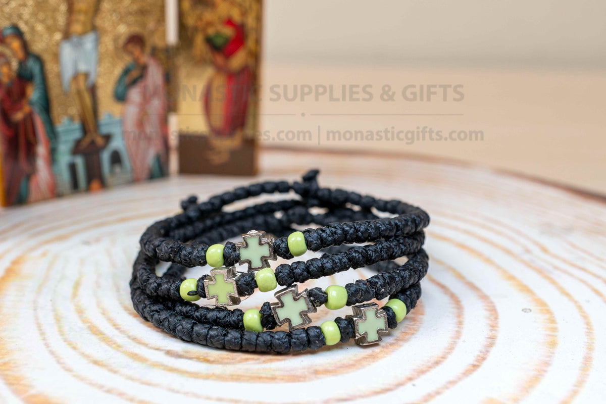 Prayer rope komboskini bracelet with light green enamel cross and black knots made in Greece[cite: 7]