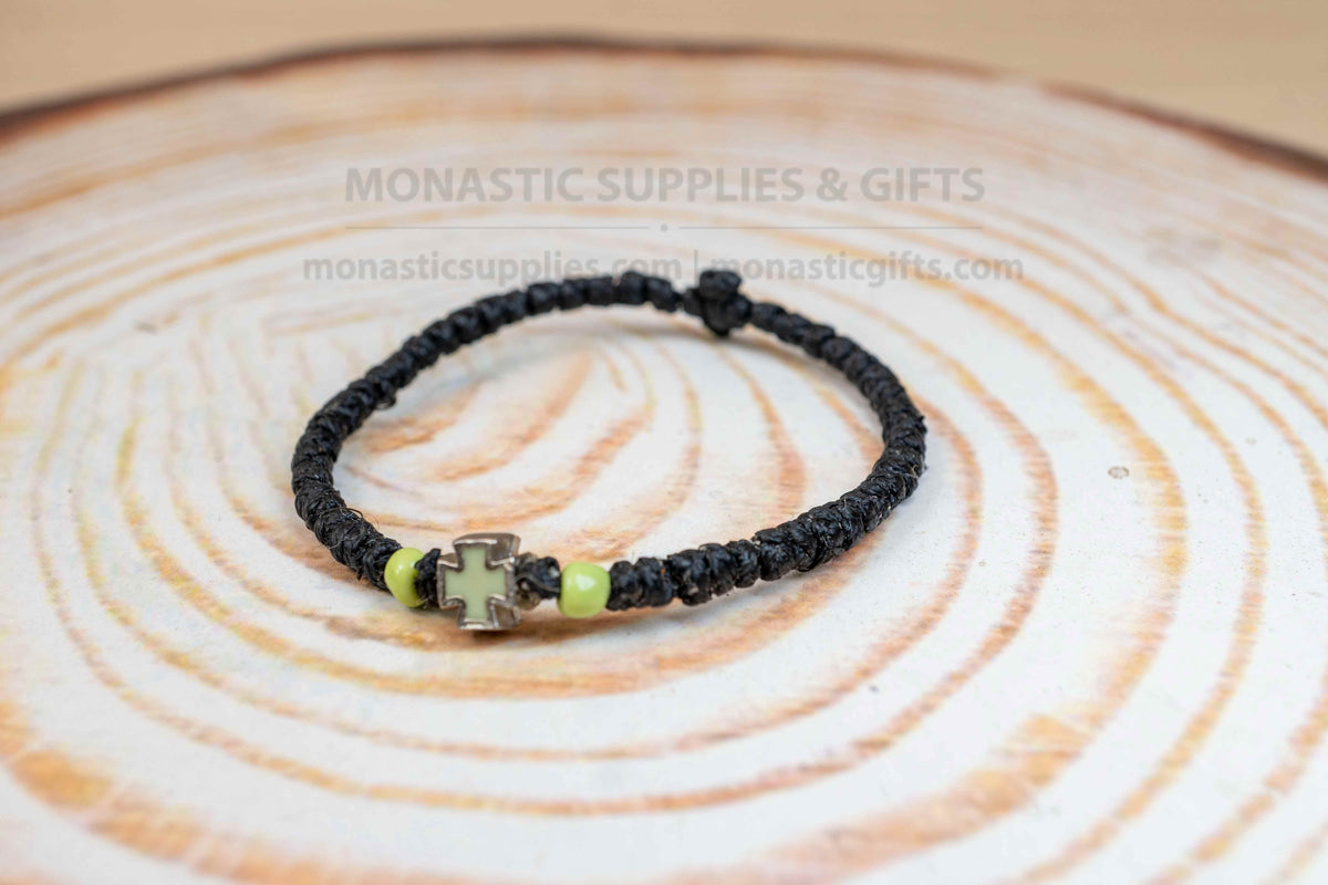 Prayer rope komboskini bracelet with light green enamel cross and black knots made in Greece[cite: 7]