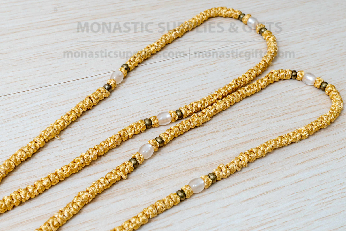 Gold 100 knots prayer rope komboskini with white divider beads and knotted cross made in Greece