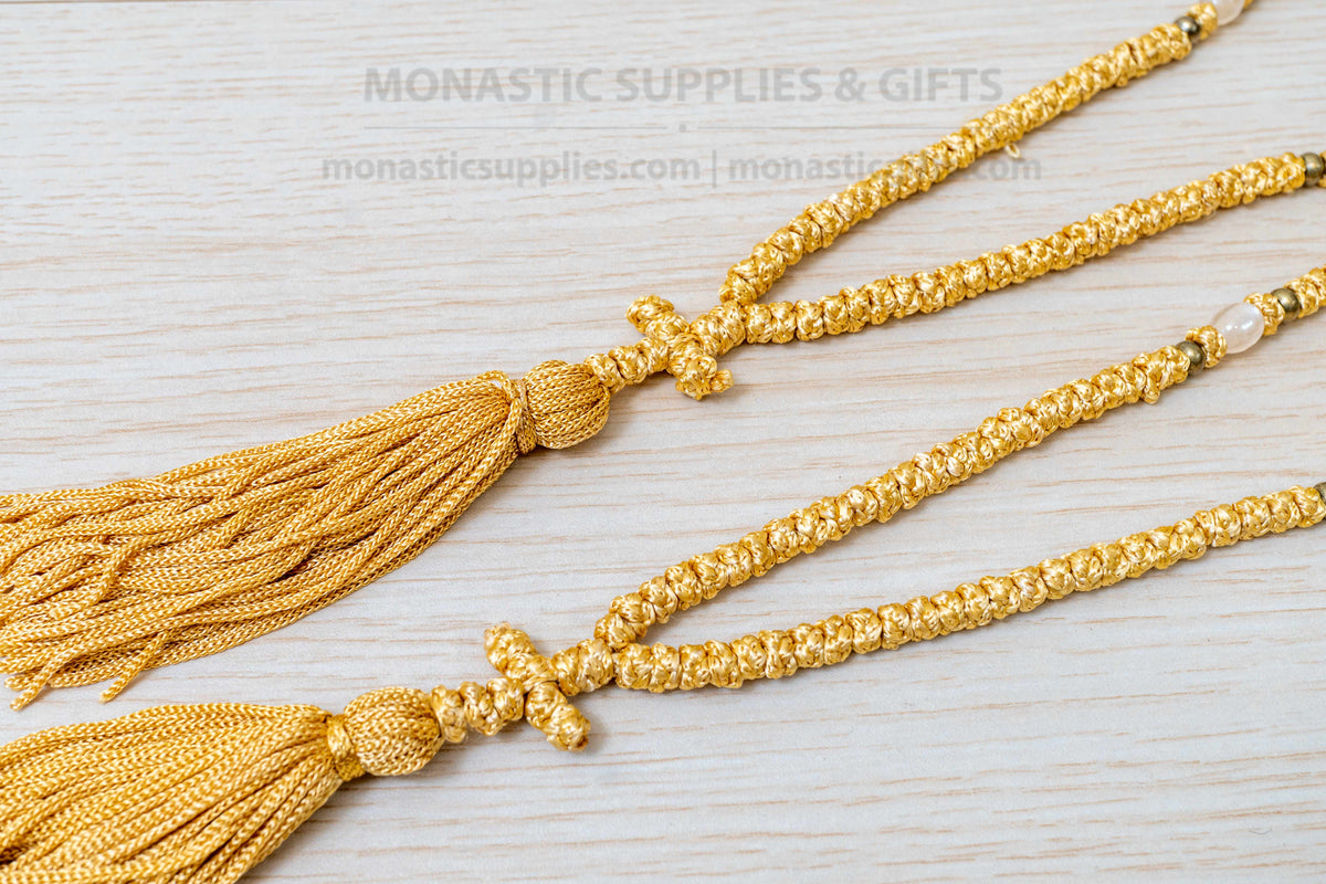 Gold 100 knots prayer rope komboskini with white divider beads and knotted cross made in Greece