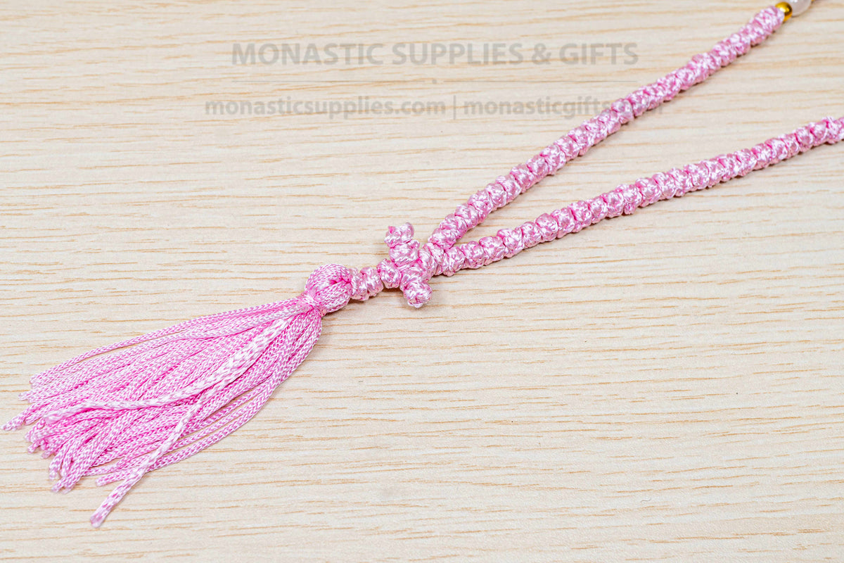Pink 100 knots prayer rope komboskini with white divider beads and knotted cross made in Greece