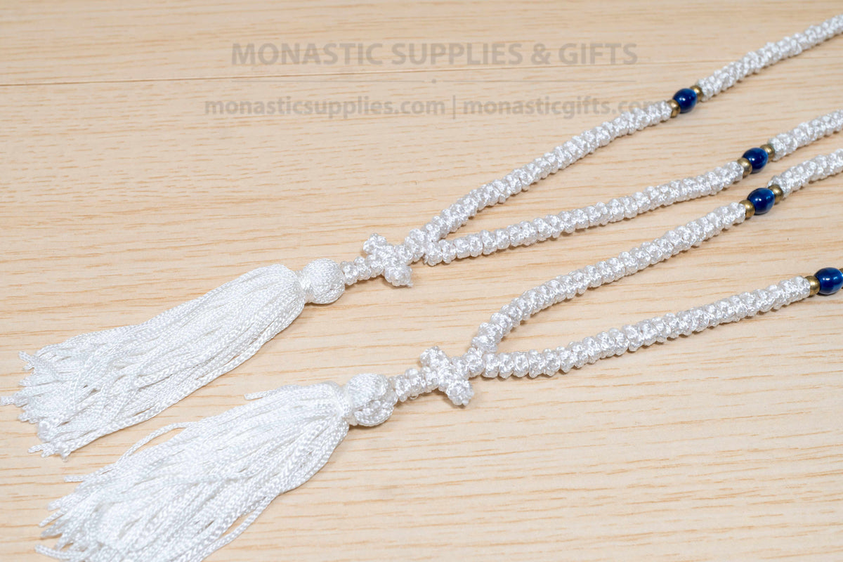 White 100 knots prayer rope komboskini with blue divider beads and cross made in Greece
