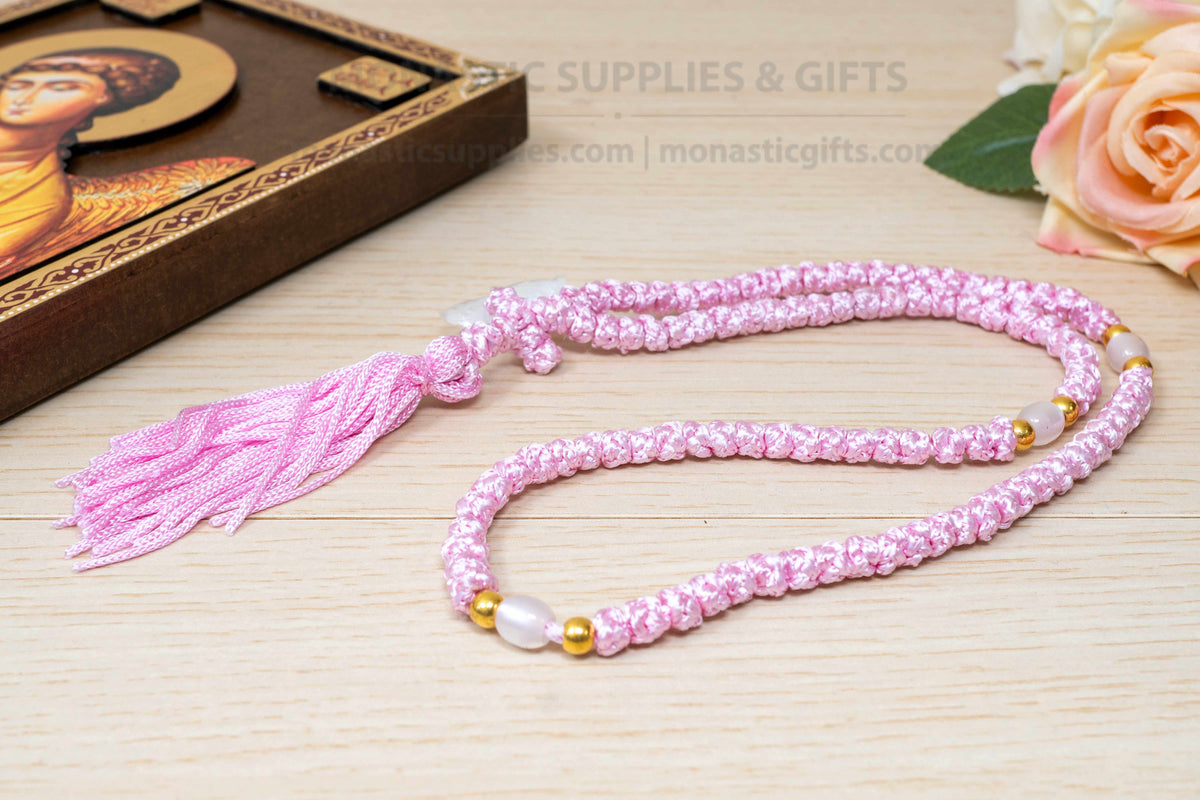 Pink 100 knots prayer rope komboskini with white divider beads and knotted cross made in Greece