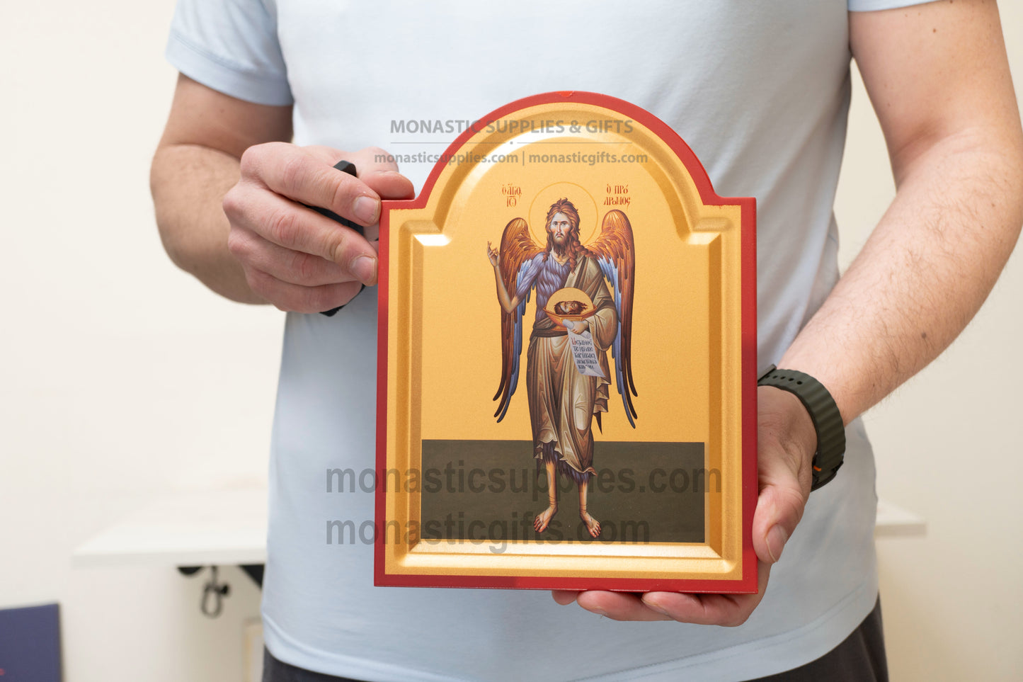 Handcrafted arched Eastern Orthodox icon of St. John the Baptist with wings as the Angel of the Desert featuring a tabletop stand.