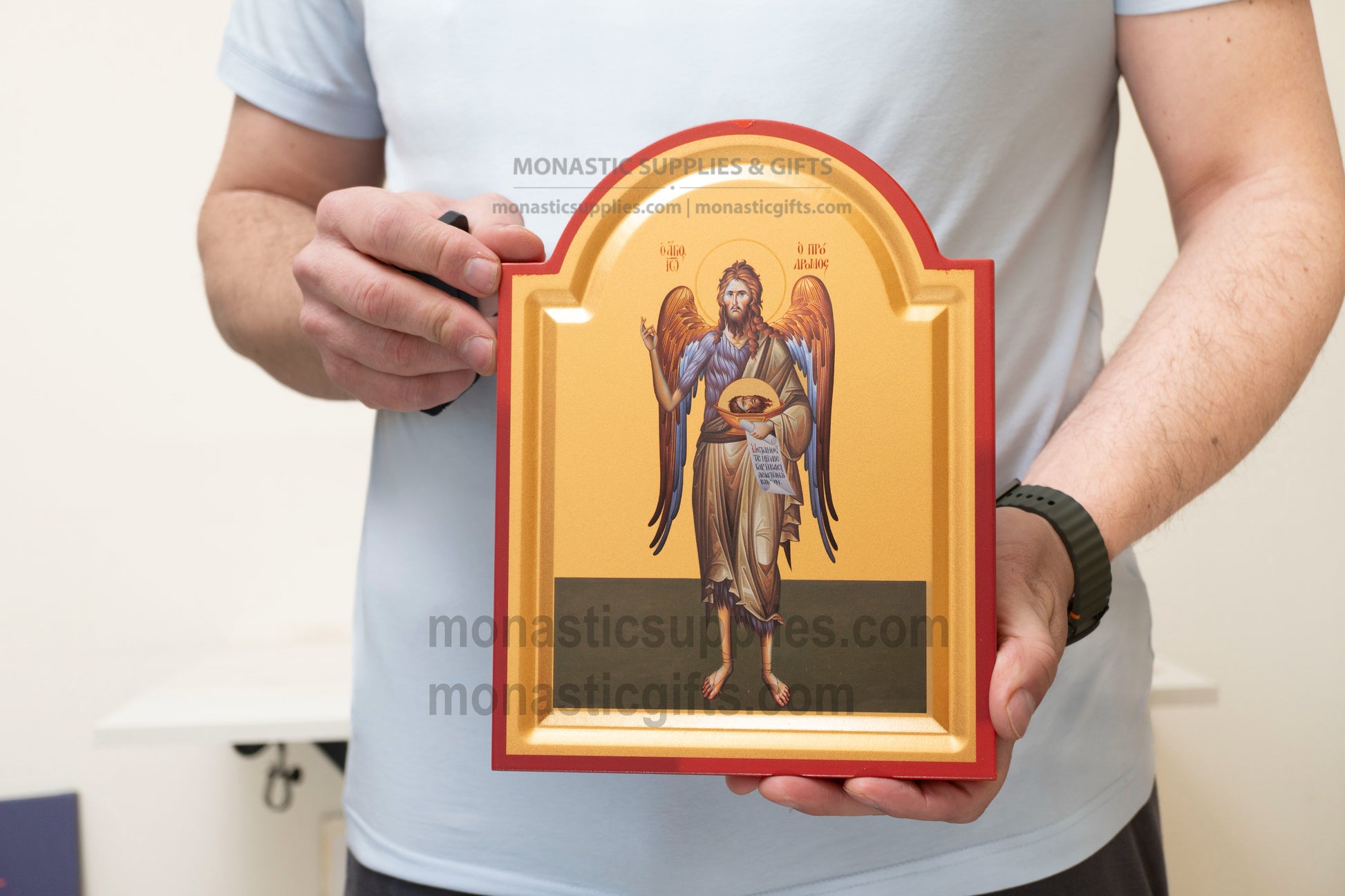 Handcrafted arched Eastern Orthodox icon of St. John the Baptist with wings as the Angel of the Desert featuring a tabletop stand.